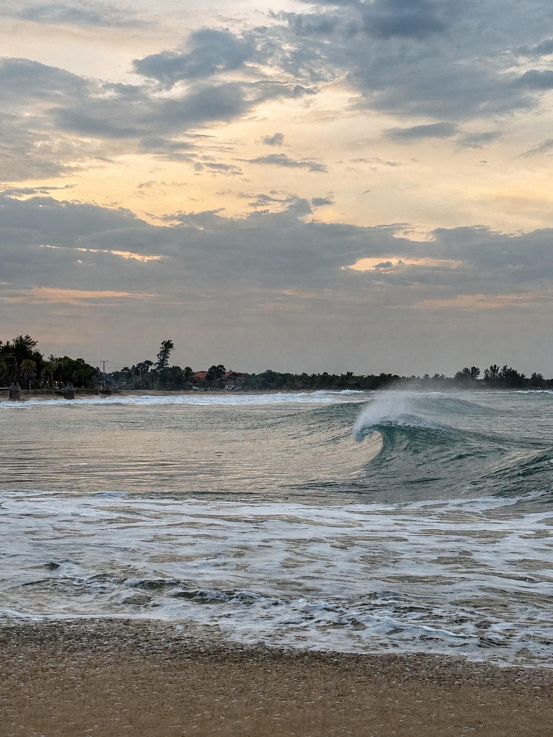 Golden-hour shorebreak on the Arugam Bay coast